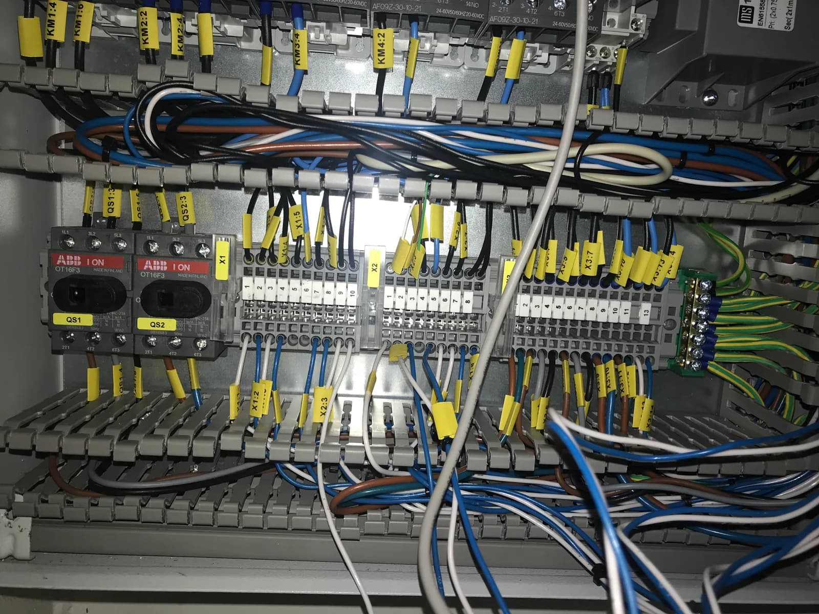 Labelled terminals, wiring and control components inside a vessel control cabinet