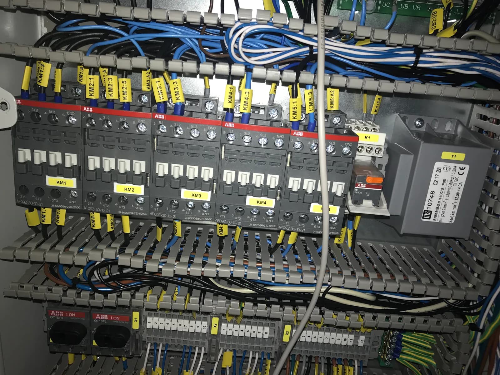Marine machinery automation control panel with labelled wiring and control components during project work